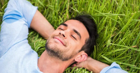 Man laying on grass